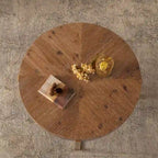 Table basse ronde avec plateau en bois et pieds croisés en métal